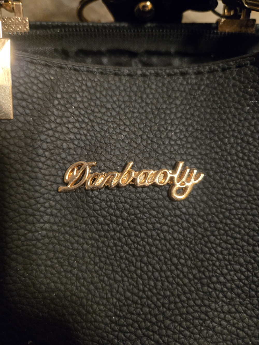 Black Pebbled Shoulder Bag with Gold Logo Accent